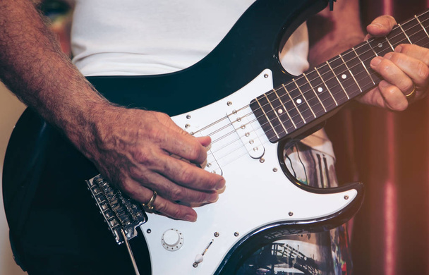 Close up of man hand playing guitar - Фото, зображення