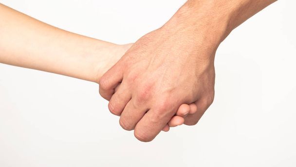 Fathers hand leading his son, white background - Foto, Imagen