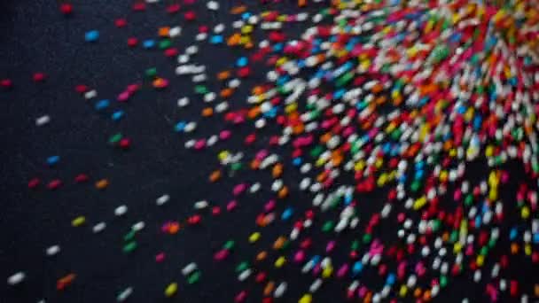 Colorido de bola de azúcar en fondo abstracto de cámara lenta
 - Metraje, vídeo