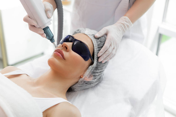 Nice pretty woman receiving laser skin treatment - Foto, immagini