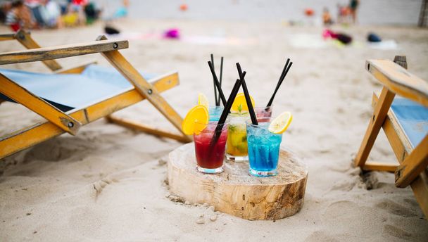 Exotic summer drinks , blur sandy beach on background. Vacation concept. - Zdjęcie, obraz