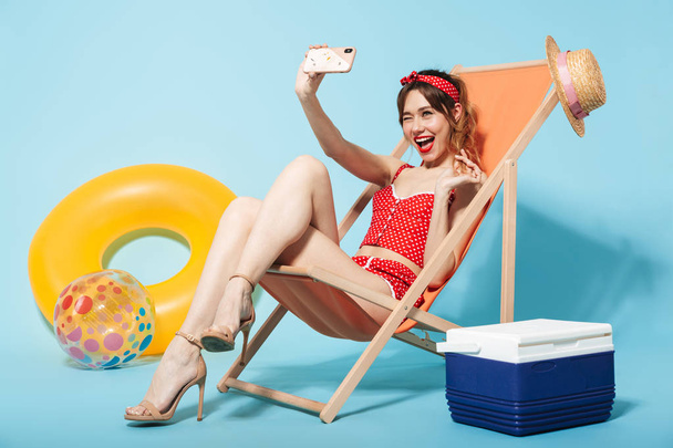 Beautiful young woman wearing swimsuit relaxing - Фото, зображення