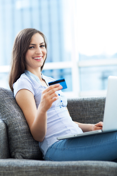 Woman with laptop and credit card - Photo, Image