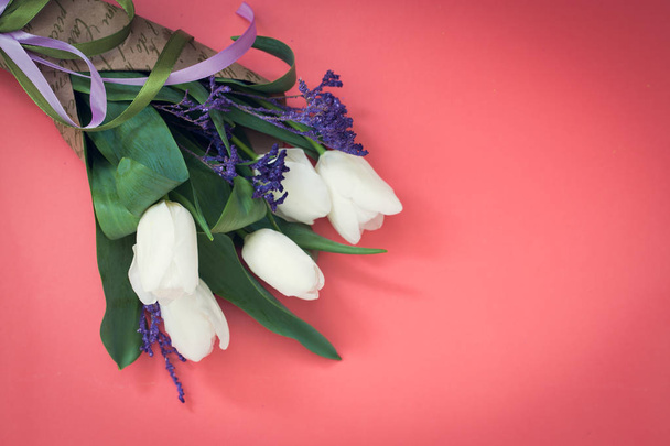 bouquet of white tulips on a pink background, with copy space for text - Photo, Image