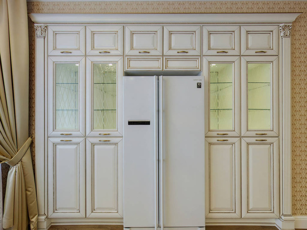 Ekaterinburg, Russia, Oktober 01, 2014. Stylish Interior of modern comfortable kitchen with cupboard, fridge and curtain - Zdjęcie, obraz