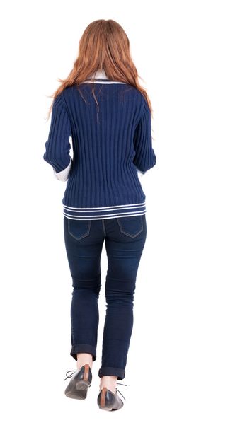 back view of running woman in jeans - Фото, изображение