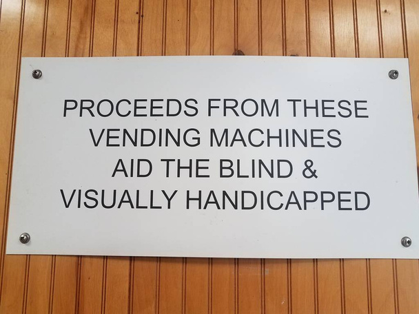 proceeds from vending machines aid the blind sign on wall - Photo, Image