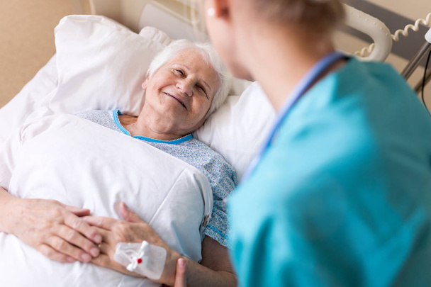 Senior patient and nurse in hospital - Photo, Image