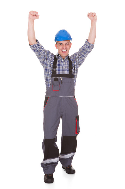 Portrait Of Male Worker With Arm Raised - Photo, Image