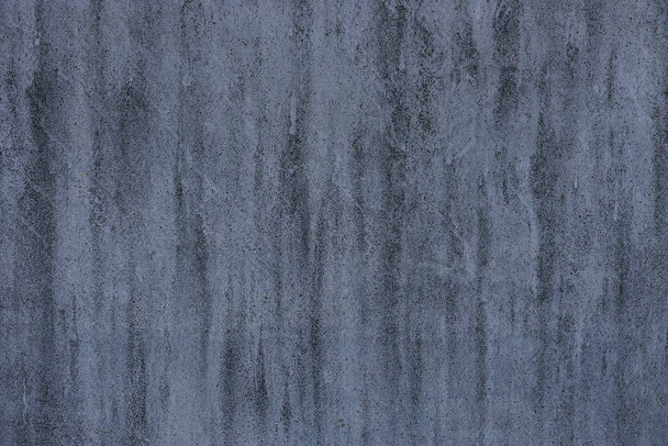 Gray background from a fragment of the foundation of a concrete wall of a building - Photo, image