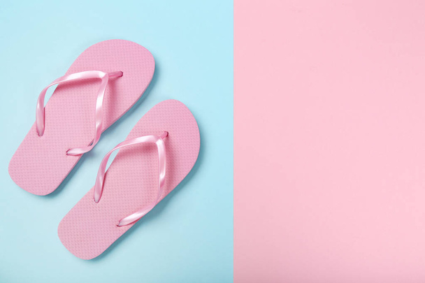 Pair of flip flops on colorful background - Фото, изображение