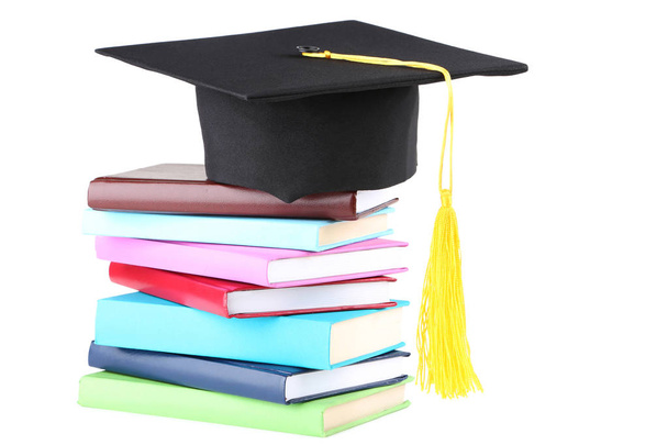 Graduation cap with books isolated on white background - Foto, afbeelding