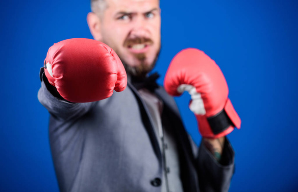 knockout and energy. Fight. businessman in formal suit and bow tie. Business and sport success. powerful man boxer ready for corporate battle. bearded man in boxing gloves punching. no pain no gain - Фото, зображення