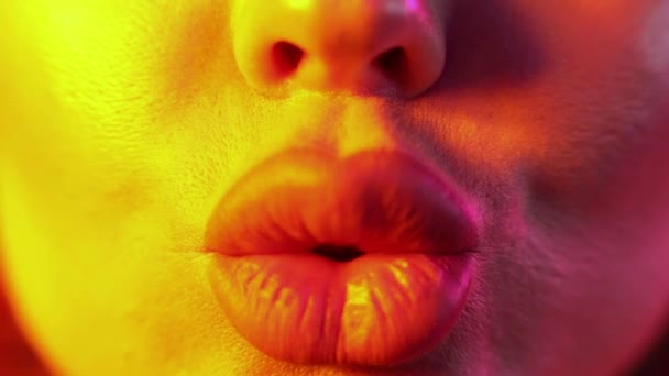 Extreme close-up plump female sexy lips wearing nude lipstick making kiss and smiling - Video