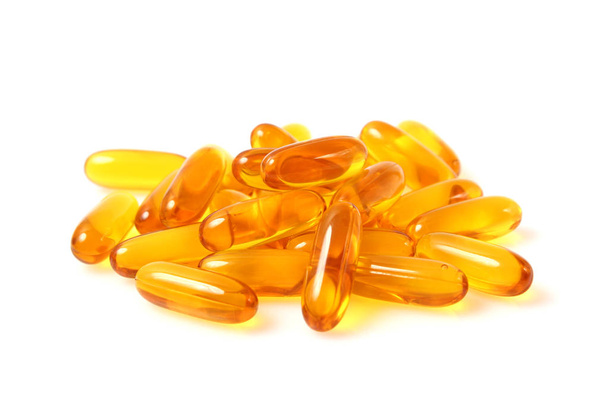 Omega-3 capsules on a white background. Fish oil, healthy supplements - Фото, зображення