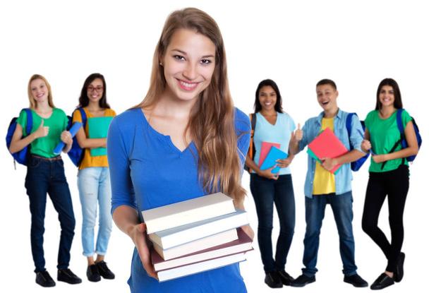 Смеющаяся немецкая студентка с книгами и группой студентов
 - Фото, изображение