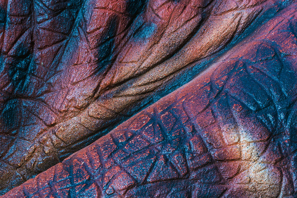 Close up to Colorful and patterns of  dinosaur model surfaces created with cement - Photo, Image