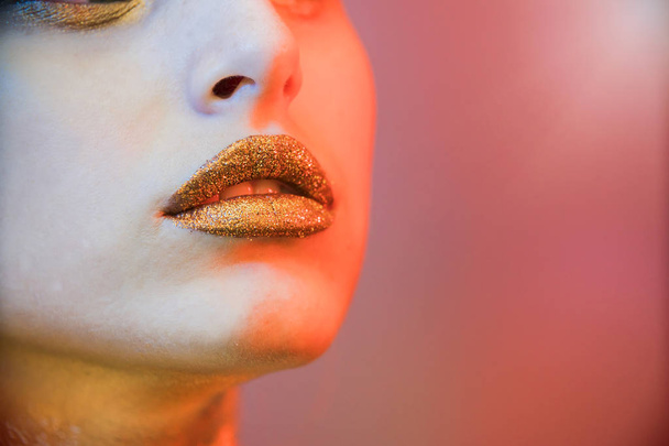 close up portrait girl hold makeup brush, gold face makeup - Photo, Image