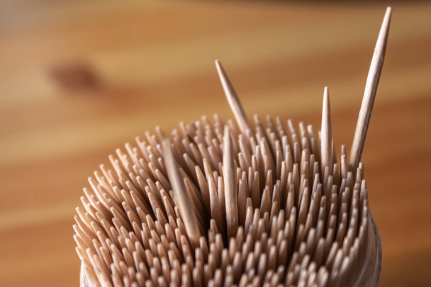 The box of wooden toothpicks with some toothpicks standing out - Image - Photo, image
