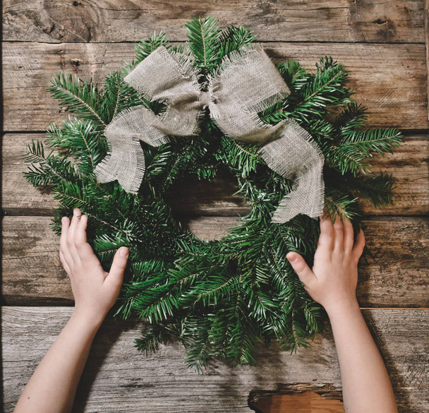 Christmas wreath fir branches decorated ribbons bow - Fotoğraf, Görsel