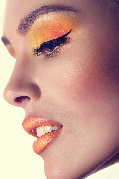 Portrait of beautiful young woman with makeup - Fotografie, Obrázek