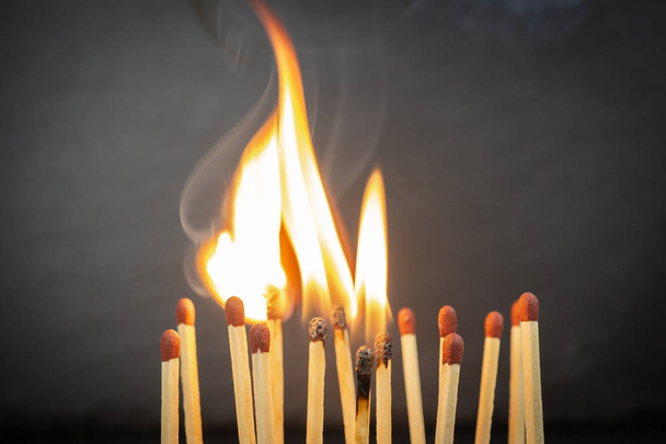 A group of matches, some of which are burning - Photo, Image