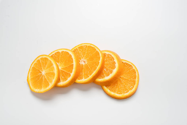  slices of orange on a white background - Fotoğraf, Görsel