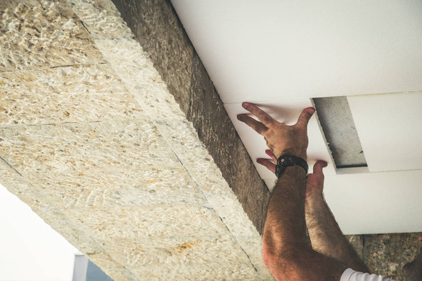 Worker installing polystyrene insulation boards  - Fotoğraf, Görsel