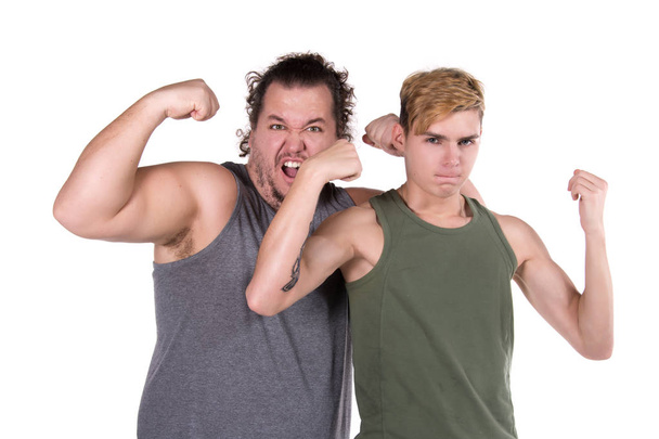 Two funny guys and fitness. White background. - Photo, image