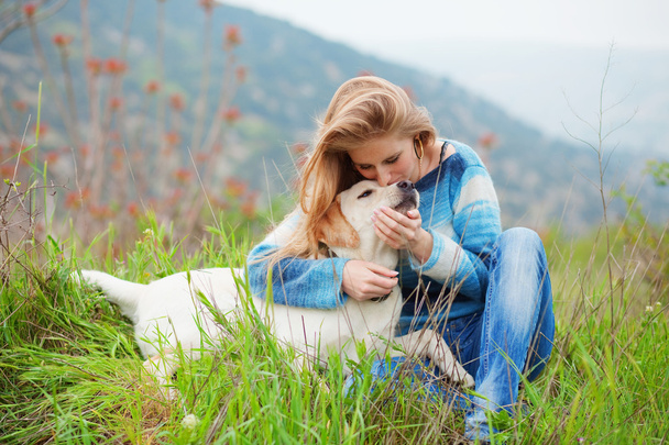 Girl with her dog - Фото, изображение