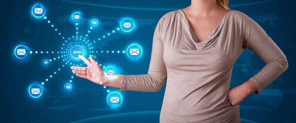 Woman pressing virtual messaging type of icons - Photo, Image