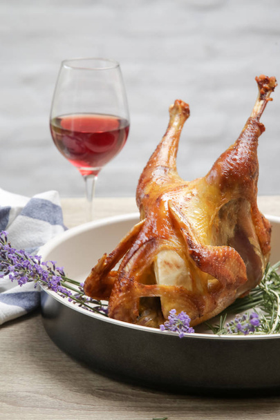 Whole homemade baked organic chicken in the trey with lavender and rosemary - Foto, Imagen