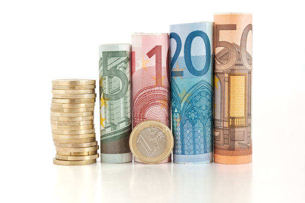Euro rolled bills and coin - Fotoğraf, Görsel