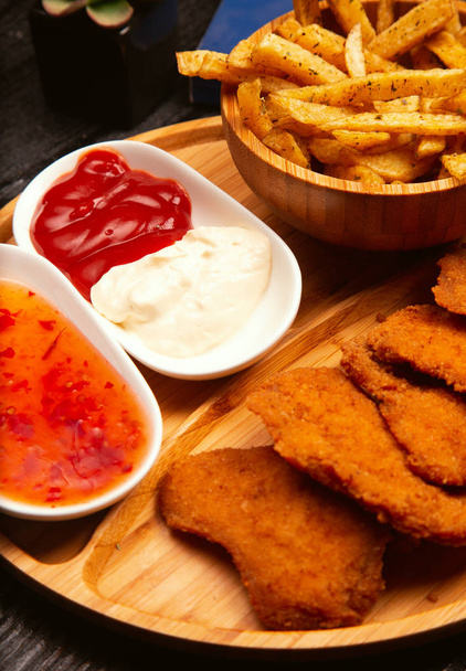 Chicken nuggets  served with french fries. - Fotografie, Obrázek