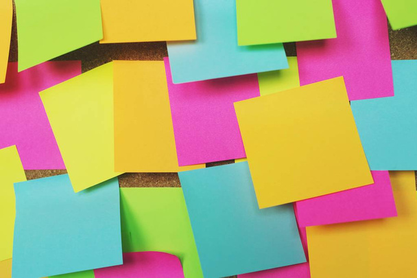 collection of colorful variety post it. paper note reminder sticky notes pin on cork bulletin board. empty space for text. - Photo, Image