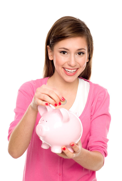 Young woman with piggy bank - Φωτογραφία, εικόνα