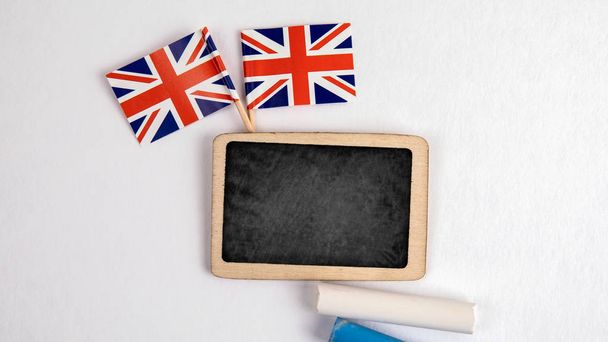 British flags. Small whiteboard with chalk - Foto, afbeelding