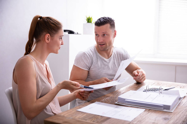 Young Couple Arguing About Expensive Invoice At Home - Photo, Image