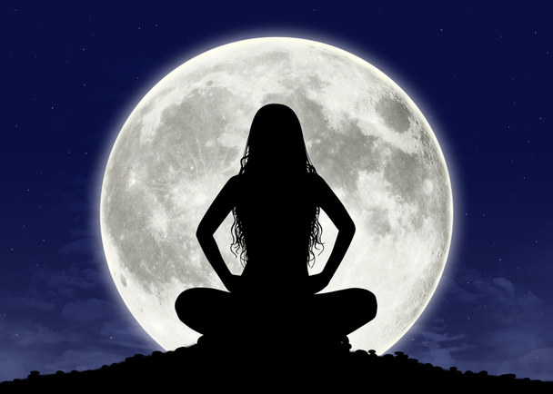 young woman in meditation at the full moon - Photo, Image