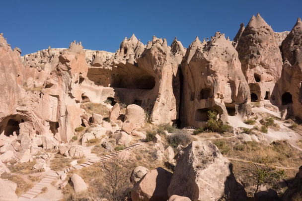 View of Cappadocia. Turkey. A geological formation consisting of volcanic tuff with cave dwelling. Cave monastery in Goreme Central Anatolia. - Fotoğraf, Görsel