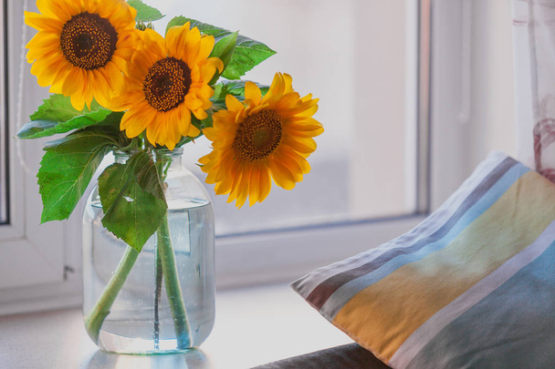 Bouquet of yellow sunflowers is on  windowsill - Foto, immagini