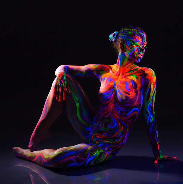 Seductive naked dancer with colorful UV make-up - Photo, Image