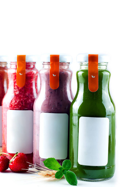 Set with color smothies in glass bottles with copy space on white background, mock-up - Photo, Image