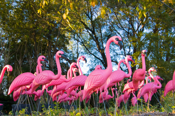 Dramatic Fake Flamingo Flock In The Forest - Photo, Image