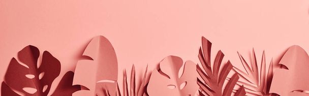 top view of paper cut palm leaves on pink background, panoramic shot - Zdjęcie, obraz