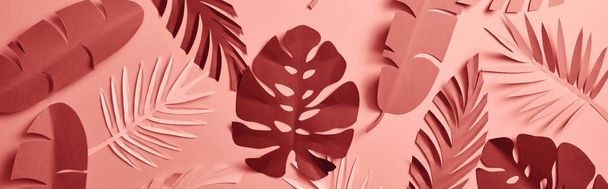 top view of paper cut palm leaves on pink background, seamless pattern, panoramic shot - Φωτογραφία, εικόνα