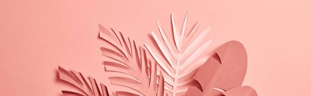 bunch of paper cut palm leaves on pink background, panoramic shot - Valokuva, kuva