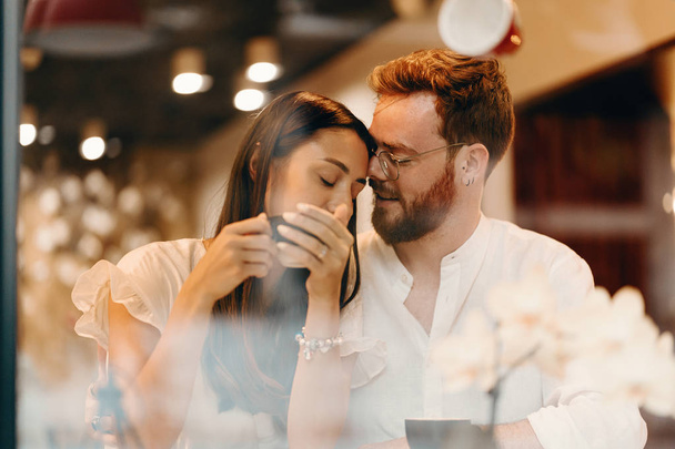 Loving couple in a coffee shop - Photo, Image