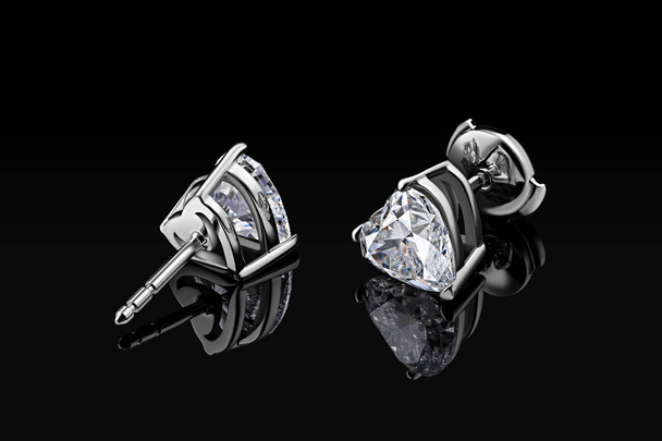 Diamond earrings. Luxury earrings gemstone diamond heart shape cut isolated on black background - Photo, Image