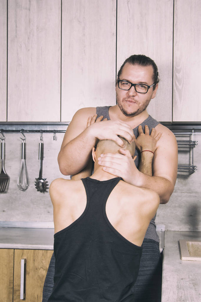Funny couple in the kitchen. Gay relationship. - Valokuva, kuva